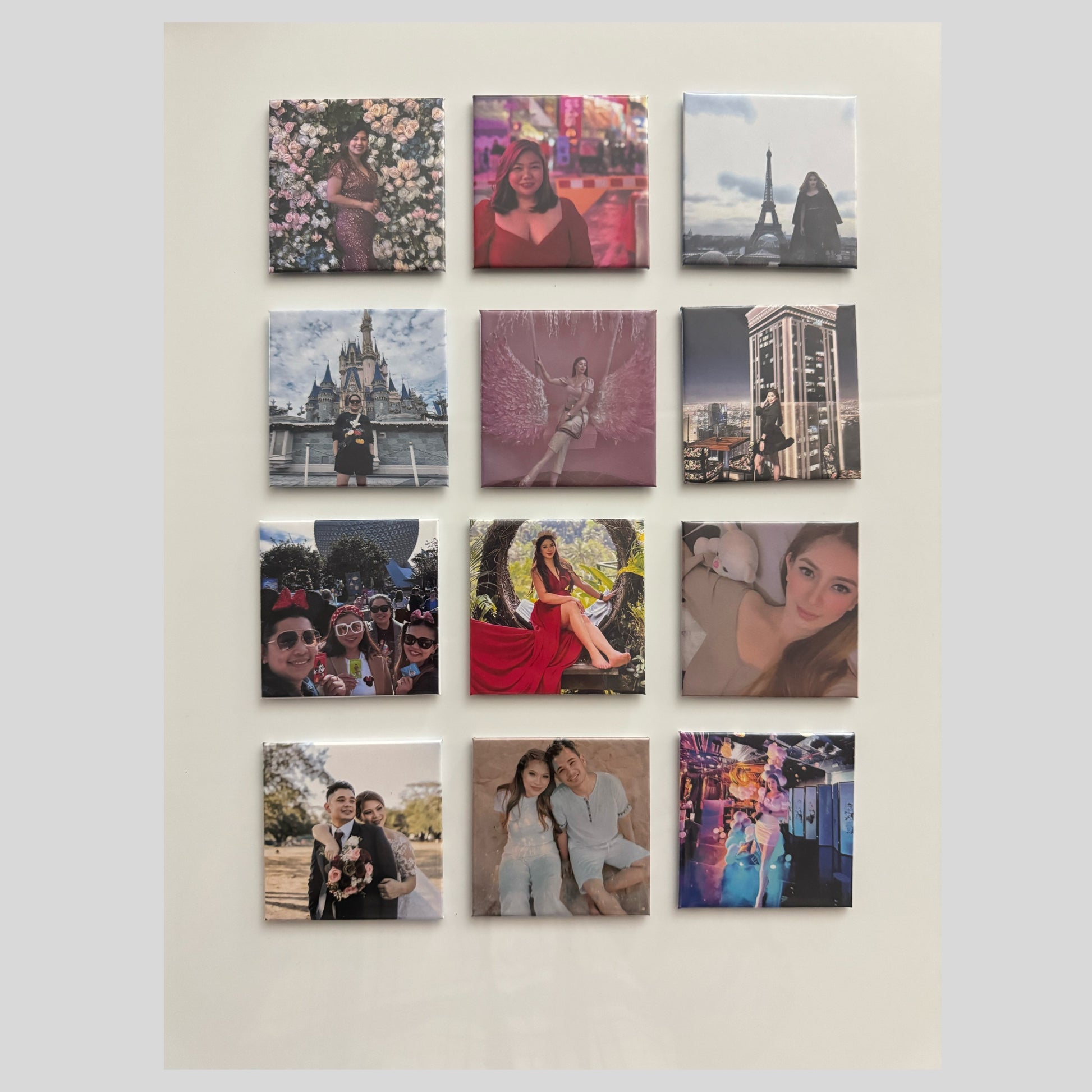 A close-up of a whiteboard displaying 12 square photo magnets featuring various travel and personal moments.